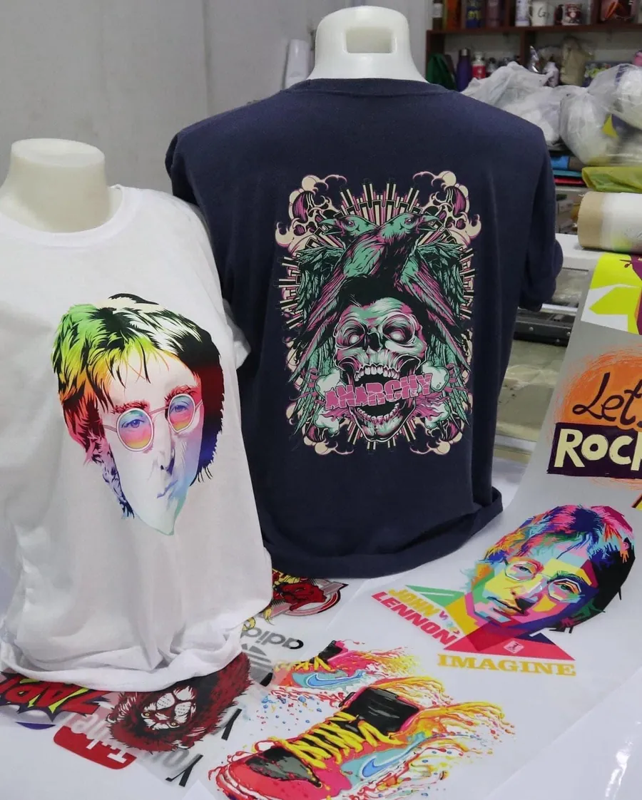 Finished shirts pressed with full-colour DTF transfers